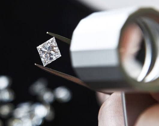Gemologist inspecting a gemstone